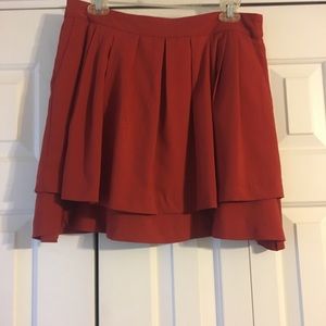 Red pleated skirt